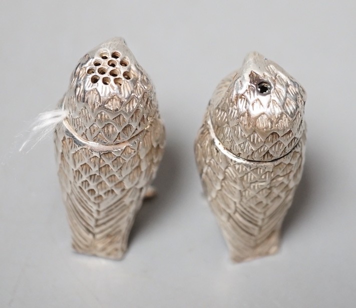 A modern novelty silver condiment, modelled as an owl and a similar unmarked companion, 52mm